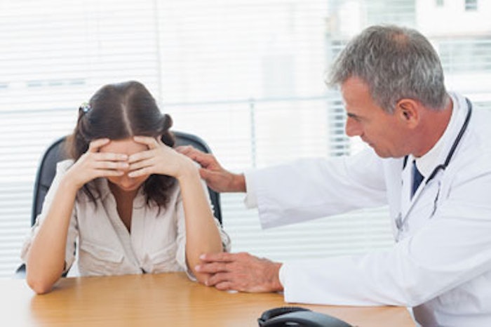 Doctor Comforting Patient 180411698