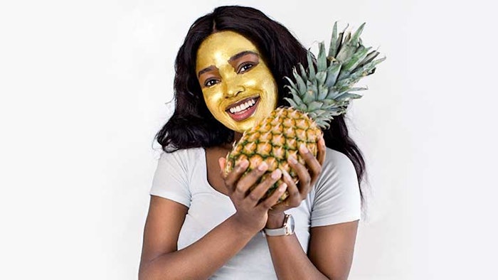 Woman holding pineapple
