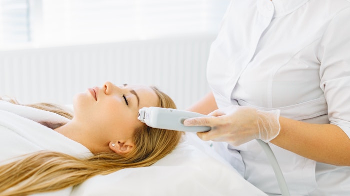 Woman laser face treatment