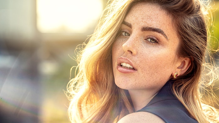 Woman in sun with freckles