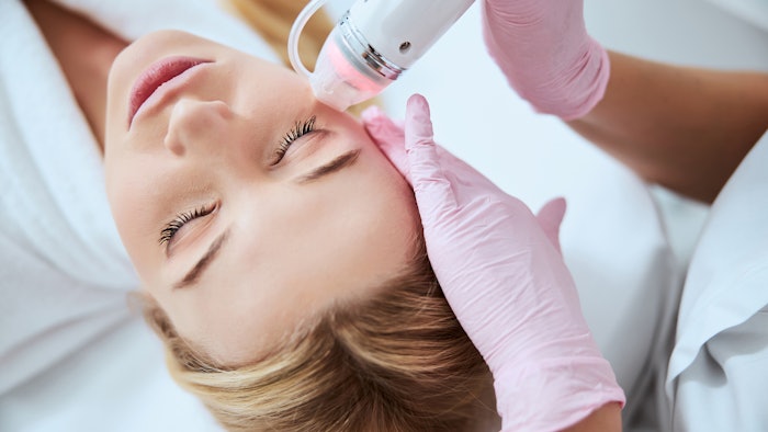 Woman eye area treatment
