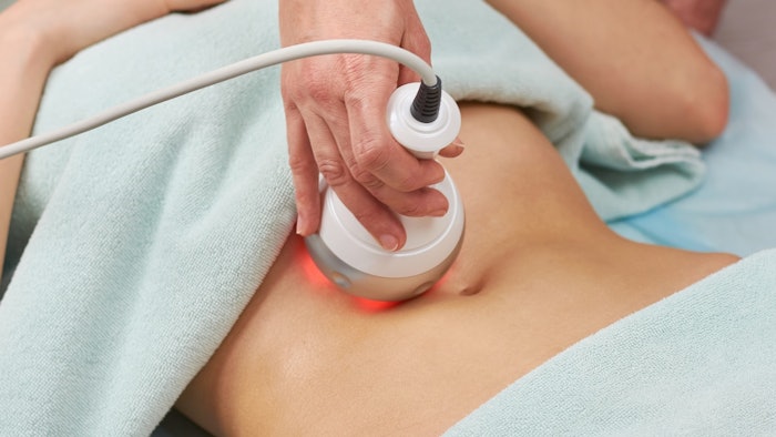 Woman getting body contouring treatment