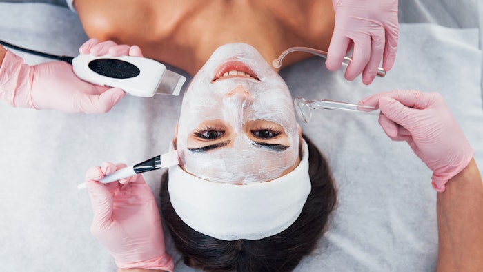 Woman having multiple devices used on her in spa
