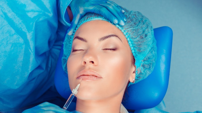 Woman getting lip filler