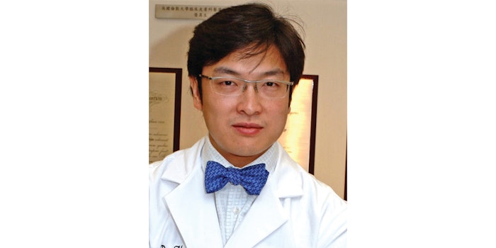 Henry H.L. Chan, MD, PhD, FRCP, president of ASLMS