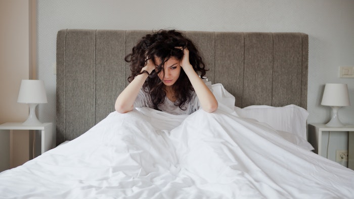 Woman depressed in her bed