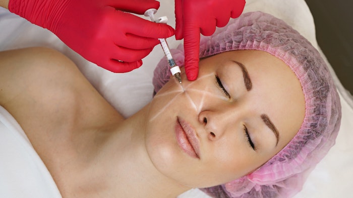 Woman getting HA fillers in cheek