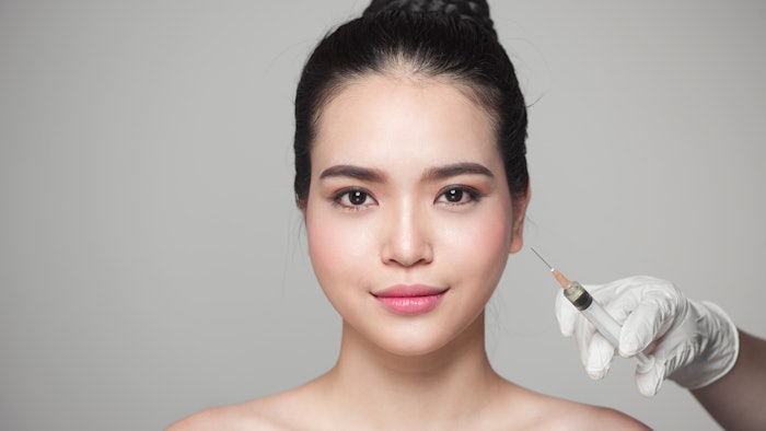 Woman getting filler in face