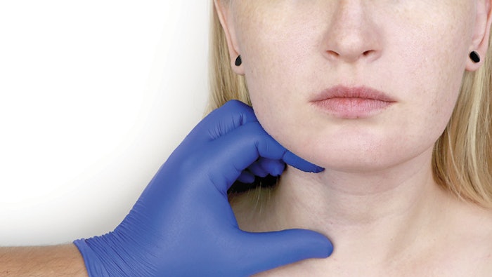 Woman getting examine for neck treatment.