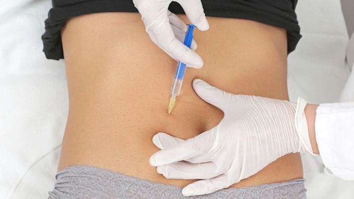 Woman getting Botox Injections in abdomen