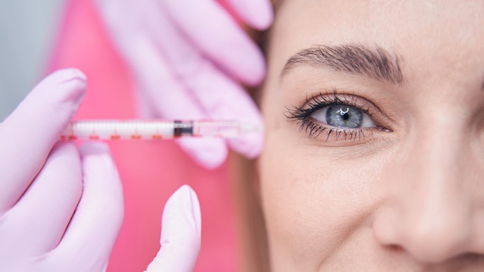 Woman getting filler under eyes