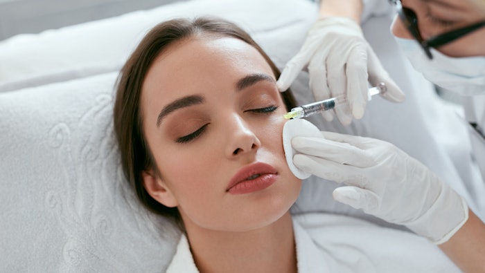 woman receiving filler injection