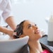 Happy client getting her hair done at a hair salon