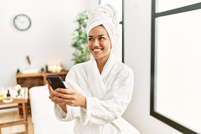 Woman using spa software in spa