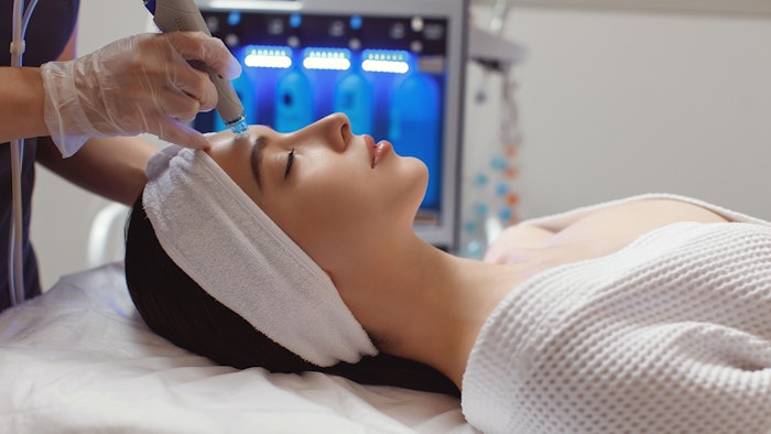 Woman receiving HydraFacial Treatment in Spa