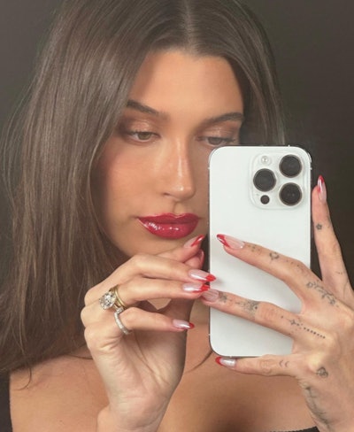 Hailey Bieber's candy cane glazed nails.