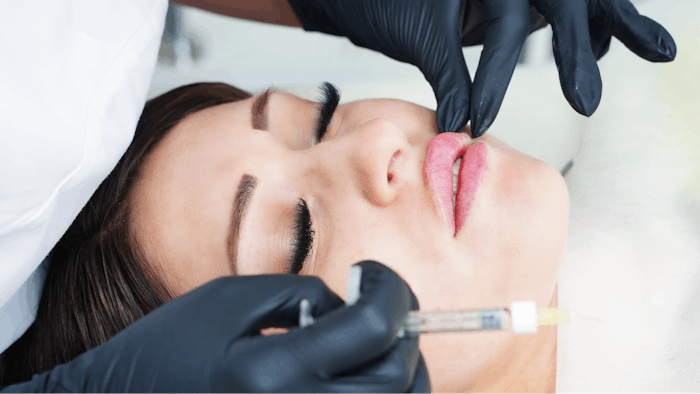 woman receiving lip injection