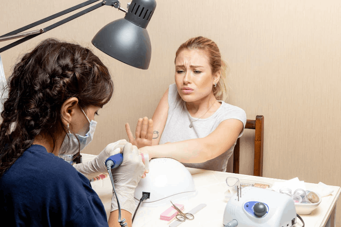Front View Young Female Getting Her Nails Fixed By Manicurist Inside Room Beauty Manicure Nails Hand Self Care Lady Female 140725 65115 Photo Room