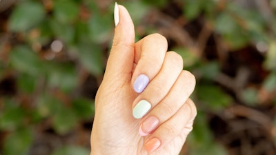 A skittle mani with a French tip detail.