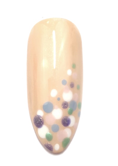 A variation on the piñata nail design, which relies heavily on a dotting tool to create.