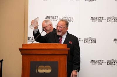 Frank Cacciato accepts the Fred A. Piattoni Award for Industry Service at America's Beauty Show 2023.