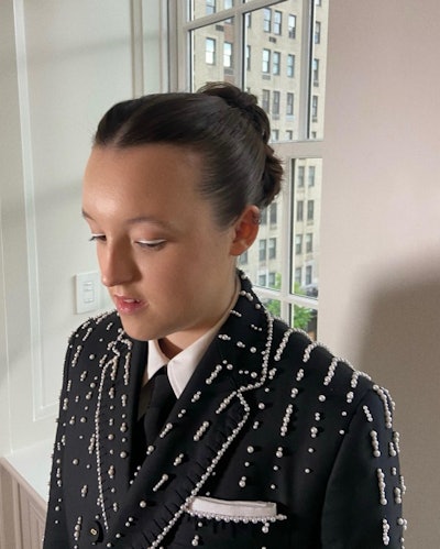 The Last of Us Actress Bella Ramsey worked with celebrity hairstylist Kiley Fitzgerald on behalf of FEKKAI to create a classic sleek hairstyle that is true to her personal style and flawlessly compliments her Met Gala look.