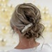 Caralee Pridemore shares how to create a clean texture boho bridal bun that's on trend this spring season.