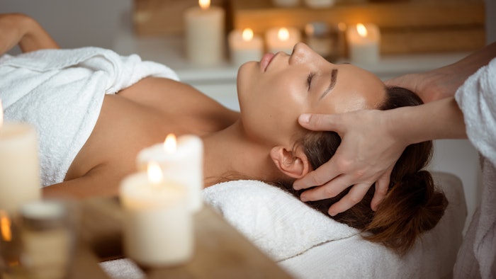 woman receiving facial massage