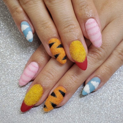 Textured Winnie the Pooh nail art featuring Pooh, Tigger and Piglet by @jeryls.polished.handcrafted