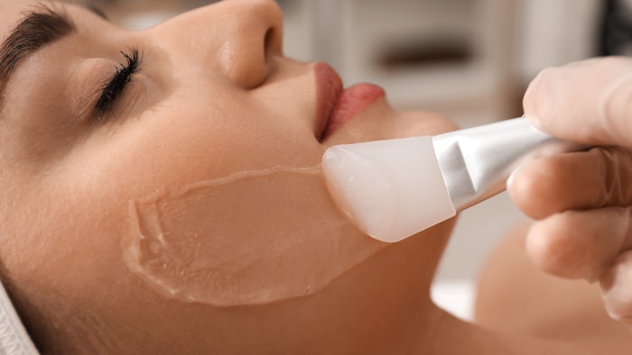 Woman getting chemical peel