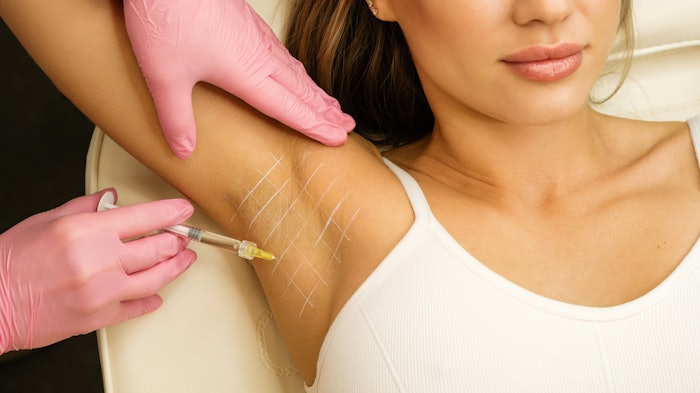woman receiving underarm botox injection