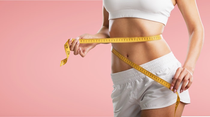 woman demonstrating weight loss