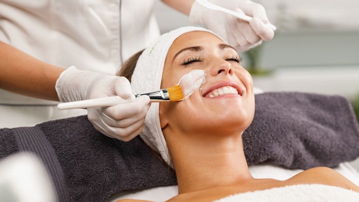 woman receiving medical aesthetics skin care treatment