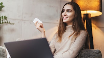 Girl using bank card for buying things online. Retail stores offering bonus cards for customers