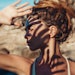 Woman Shielding Eyes from Sun