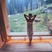sauna with a huge wide window enjoying the green forest view and pleasant healthy body care temperature treatment. Body healthcare prevention concept