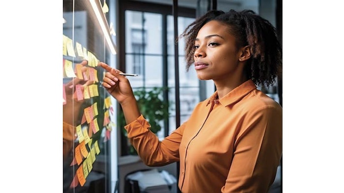 Illustration of a woman using sticky notes to brainstorm and plan in a business setting