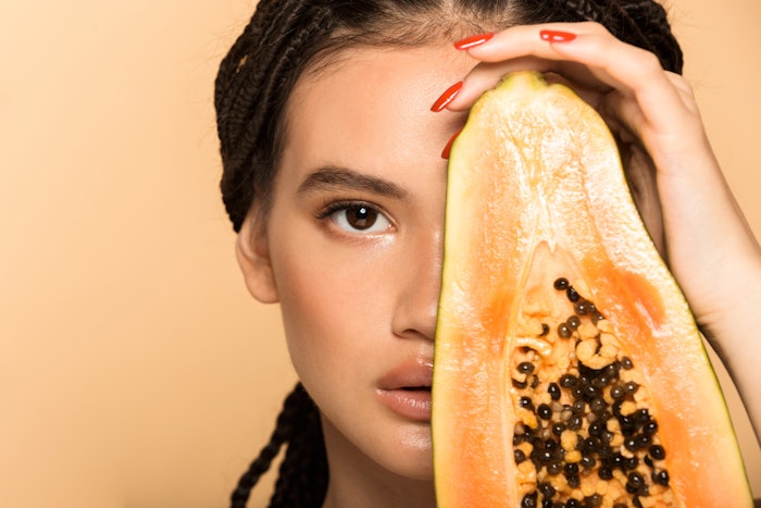 Woman holding papaya