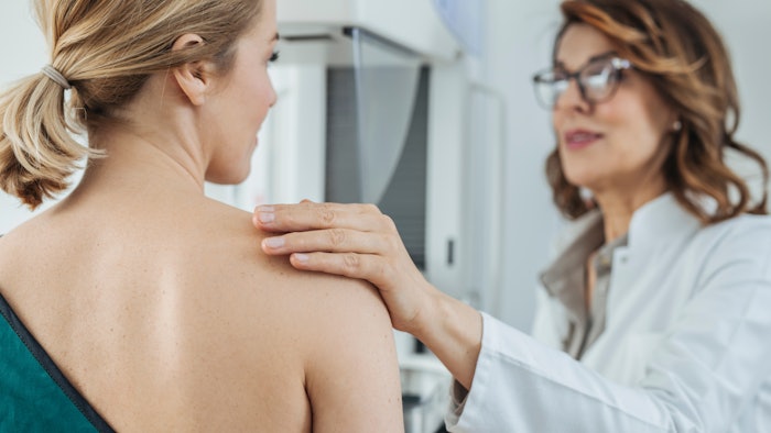 Woman Physician Talking With Her Patient