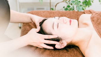 Woman getting a scalp massage.