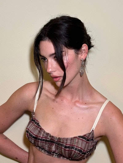 “We wanted to go up with the hair inspired by a '90s Kate Moss runway look,' Eliot says.