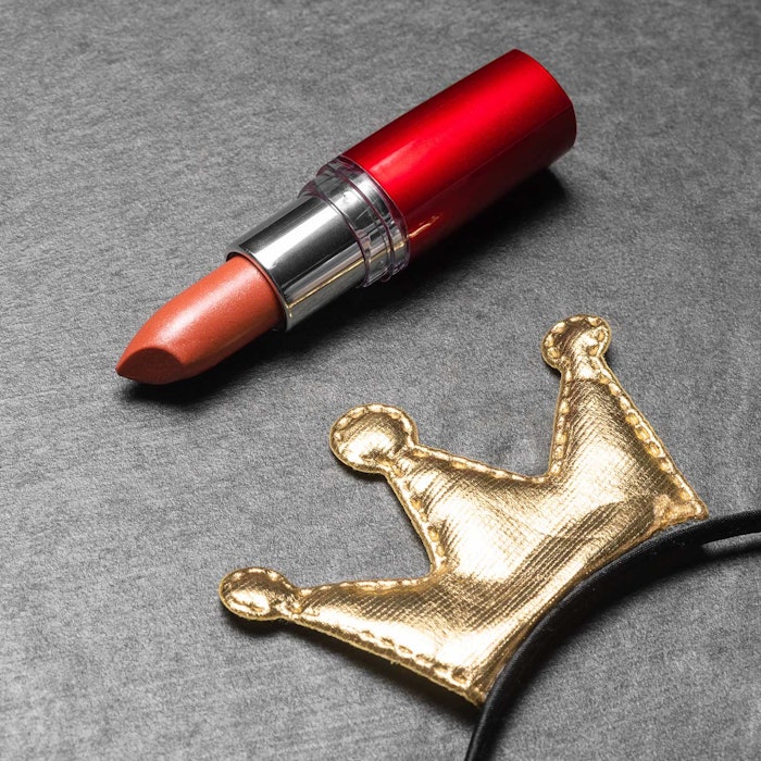 lipstick grown laying on table award concept
