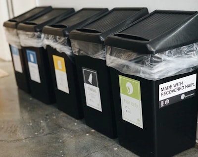 Recycling bins at a salon for hair, metals and plastic