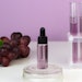 grapes extract lab glassware purple liquid and background