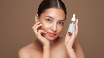 Beautiful Bruunette Holding Serum Beige Background Simple Adobe Stock 818977970