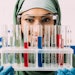 Beautiful Woman Muslim Chemist Smiling Holding Test Tubes Adobe Stock 251996580