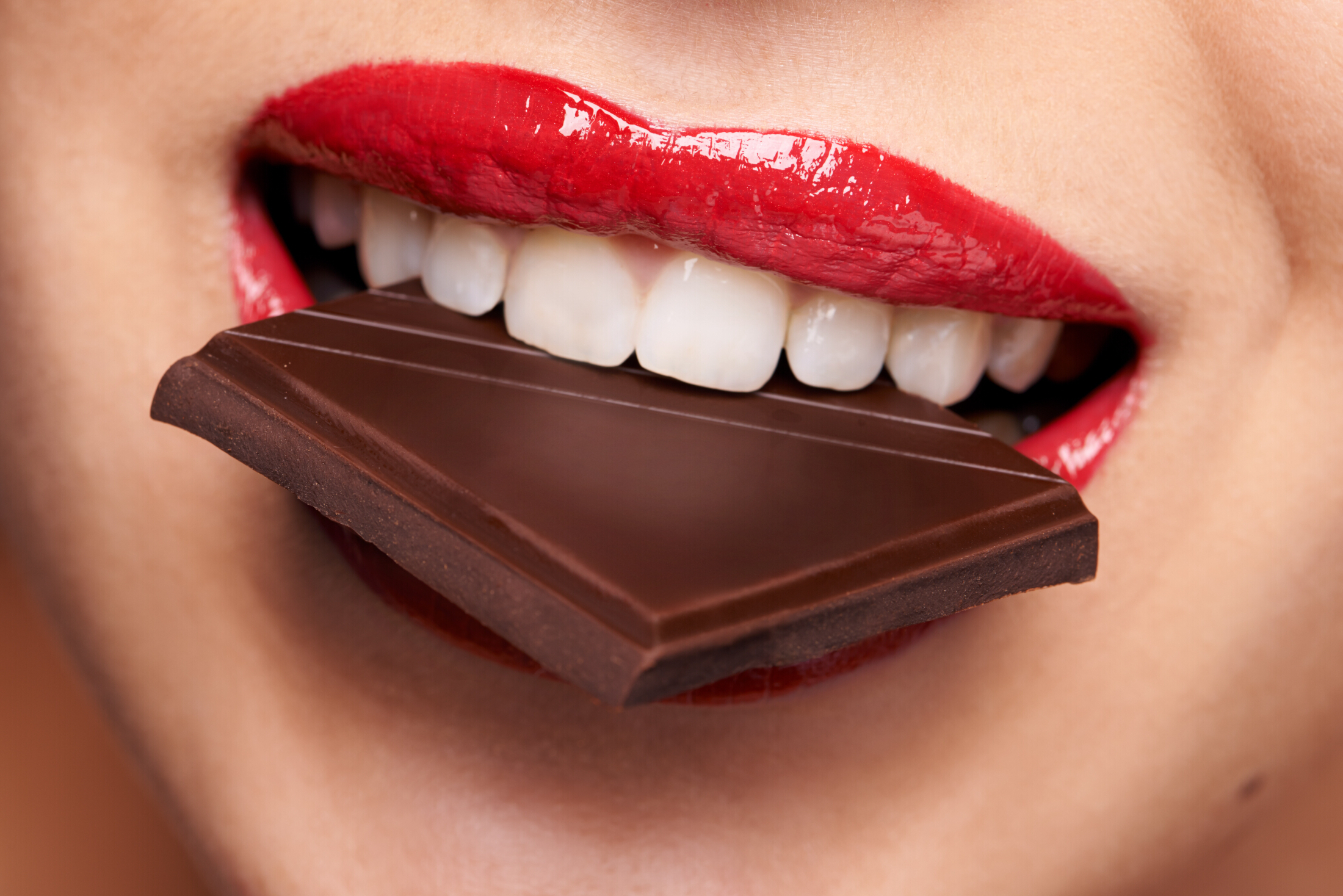 Red Lips Close Up Biting Chocolate Pib Adobe Stock 754122039 (1)