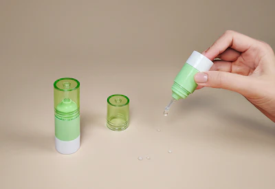 Portable packaging included an Airless Push Button Dropper in 10 ml and 15 ml sizes, designed for one-handed dispensing across multiple formulation types.