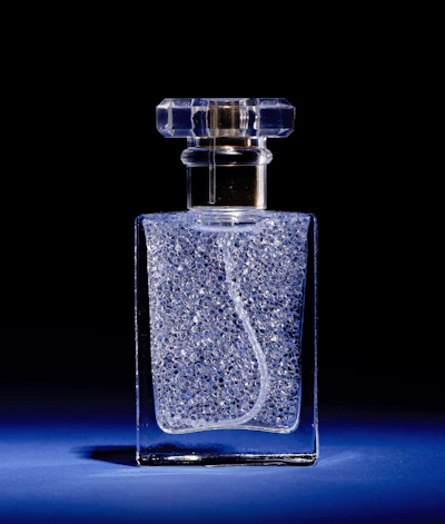Rather than dissolving perfume oil in ethanol, Perfume Pearls encapsulate pure fragrance oil inside translucent alginate shells derived from algae. The suspended microcapsules remain stable in a structured water-based formula until sprayed, when the capsules burst within the nozzle to release fragrance alongside water.