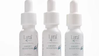 Three white dropper bottles of Lira Clinical Smart Boosters serums with teal accents, labeled PDRN+, TXA+, and NAD+